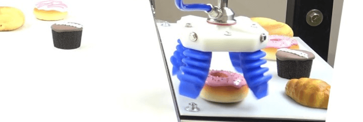 Demonstration of the robotic arm when picking up a doughnut.